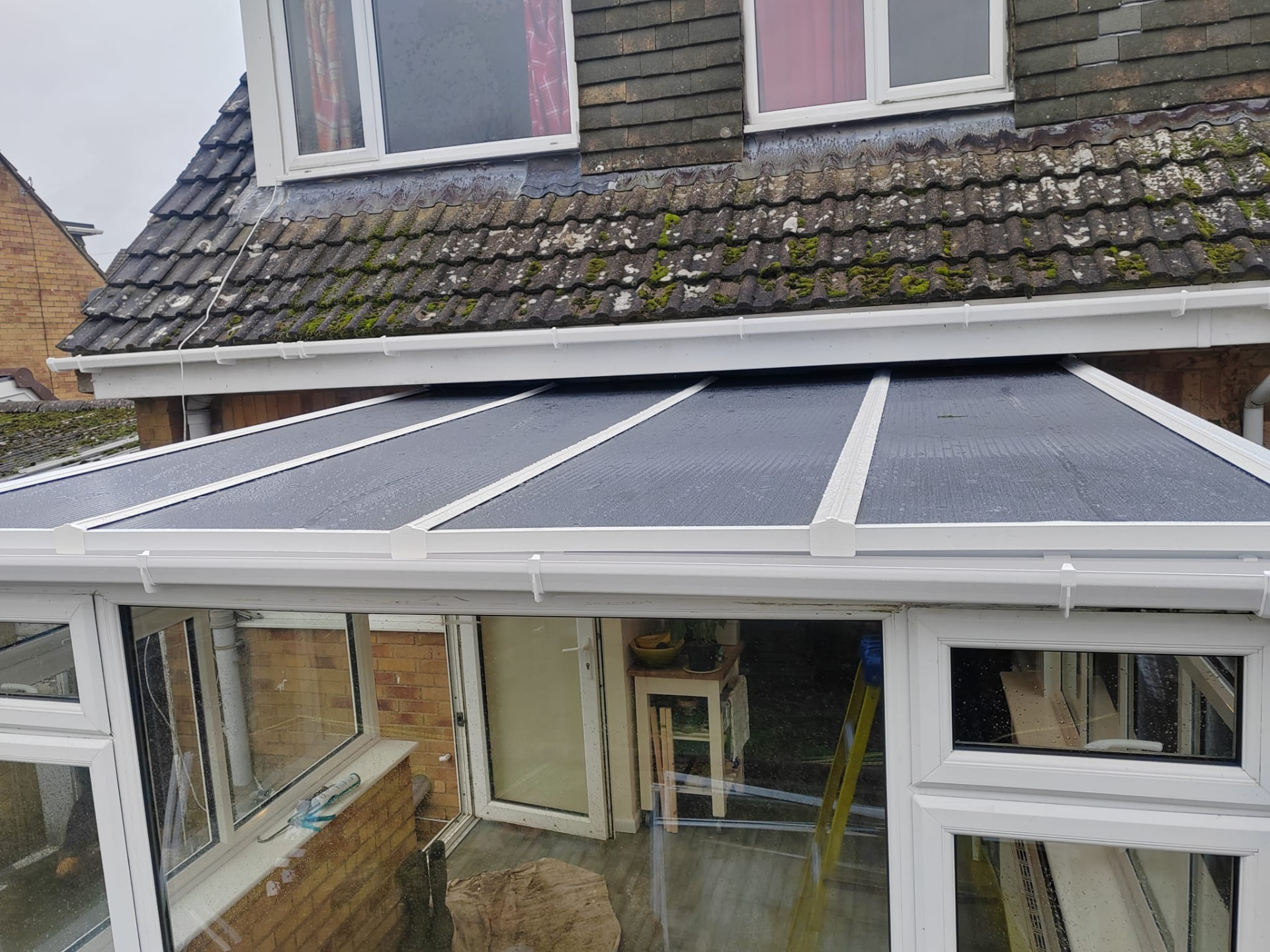 Conservatory roof replacement: new timber structure with insulated polycarbonate roof panels fitted from outside